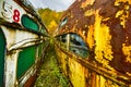 Two abandoned trolley cars side by side