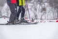 Two abstract skiers on ski slope, snow day, selective focus. Winter sport and recreation concept