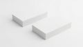 Two abstract white geometric blocks arranged in an angular formation on a plain background Royalty Free Stock Photo