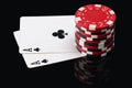 Two aces on poker cards and chip count on them Royalty Free Stock Photo