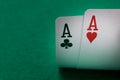 Two aces poker cards close up on a green table Royalty Free Stock Photo