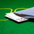 Two aces stand out from a deck of cards closeup Royalty Free Stock Photo