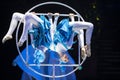 Two acrobat girls show a circus number on a dark background Royalty Free Stock Photo