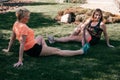 Two active senior women doing yoga outdoors, they are happy and friendly Royalty Free Stock Photo