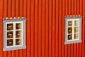 Two Adjacent Wooden Blue Windows in Old Norwegian House with Snow