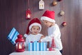 Two adorable boys, opening presents on Christmas