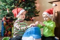 Two adorable boys playing with working humidifier, waiting for x-mas Royalty Free Stock Photo