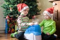 Two adorable boys playing with working humidifier, waiting for x-mas Royalty Free Stock Photo