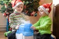 Two adorable boys playing with working humidifier, waiting for x-mas Royalty Free Stock Photo