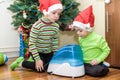 Two adorable boys playing with working humidifier, waiting for x-mas Royalty Free Stock Photo