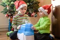 Two adorable boys playing with working humidifier, waiting for x-mas Royalty Free Stock Photo