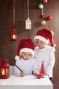 Two adorable boys, writing letter to Santa