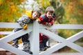 Two adorable children, boy brothers, playing in park on rainy da Royalty Free Stock Photo