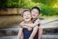 Two adorable little brothers laughing and hugging on warm and sunny day Royalty Free Stock Photo