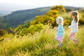 Two adorable little girls having fun in a meadow Royalty Free Stock Photo