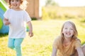 Two adorable little sisters having fun at the backyard Royalty Free Stock Photo