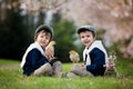Two adorable preschool children, boy brothers, playing with litt Royalty Free Stock Photo