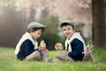 Two adorable preschool children, boy brothers, playing with litt Royalty Free Stock Photo