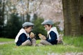 Two adorable preschool children, boy brothers, playing with little chicks Royalty Free Stock Photo