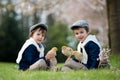 Two adorable preschool children, boy brothers, playing with little chicks Royalty Free Stock Photo