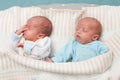 Adorable twin babies sleeping in the bed. Closeup portrait, caucasian child