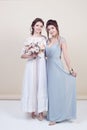 Two adorable women wearing in long fashionable dresses Royalty Free Stock Photo