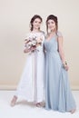 Two adorable women wearing in long fashionable dresses Royalty Free Stock Photo