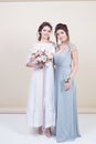 Two adorable women wearing in long fashionable dresses Royalty Free Stock Photo