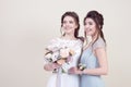 Two adorable women wearing in long fashionable dresses Royalty Free Stock Photo
