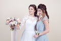 Two adorable women wearing in long fashionable dresses Royalty Free Stock Photo