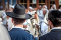 Two adult Hasidim in traditional Jewish headdresses hat and kippah. Prayer of Hasidim