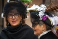 Two adult women in medieval carnival costumes in Venice