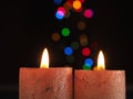 Two Advent candles burning with Christmas lights bokeh Royalty Free Stock Photo