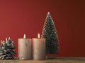 Two Advent candles burning on a red background Royalty Free Stock Photo