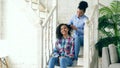 Two african american curly girls sistres make fun curly hairstyle each other and have fun at home Royalty Free Stock Photo