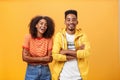 Two african american man and woman being best friends laughing out loud watching funny movie in cinema all dressed up in