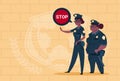 Two African American Police Women Holding Stop Sign Wearing Uniform Female Guards On Blue Bricks Background Royalty Free Stock Photo