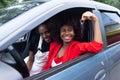 Two African American women having fun in the car