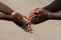 Two African Children Washing Hands Sanitizing Fingers to Avoid Contamination of Virus, Bacteria or Illness Royalty Free Stock Photo