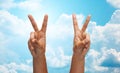 Two african hands showing victory or peace sign Royalty Free Stock Photo