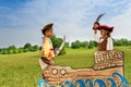 Two African kids as pirates dueling with swords Royalty Free Stock Photo