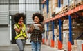 Two African little boy, girl kid playing together with happiness in warehouse or factory, using walkie talkie, pretend to be Royalty Free Stock Photo