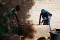 Two African Women Collecting as a Climate Change Symbol