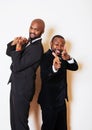 Two afro-american businessmen in black suits emotional posing, g