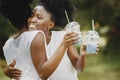 Two young afro-american sisters hugging in a park Royalty Free Stock Photo