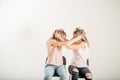 Two aggressive women arguing and shouting isolated on a white background