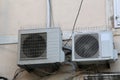 Two air conditioners hang on the wall of the house Royalty Free Stock Photo