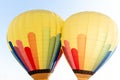 Two air hot balloons in green, blue, red  and yellow colors Royalty Free Stock Photo