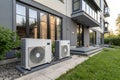 Two air source heat pumps on modern house Royalty Free Stock Photo