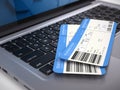 Two airline boarding pass tickets on laptop keyboard - online tickets booking concept Royalty Free Stock Photo